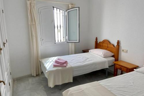 Ένα ή περισσότερα κρεβάτια σε δωμάτιο στο Precioso apartamento en Mojacar Pueblo