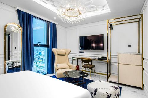 a bedroom with a bed and a desk and a chair at Hotel the Castle bangi 2nd in Seoul