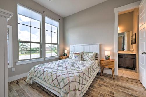 a bedroom with a bed and two windows at Upscale Austin Area Escape Families Welcome! in Austin