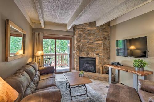 a living room with a couch and a fireplace at Frisco Condo 2 Blocks to Main St Year-Round Fun! in Frisco
