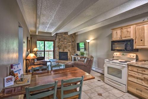 a kitchen and living room with a table and a stove at Frisco Condo 2 Blocks to Main St Year-Round Fun! in Frisco