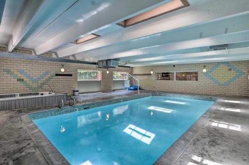 a large swimming pool in the middle of a room at Frisco Condo 2 Blocks to Main St Year-Round Fun! in Frisco
