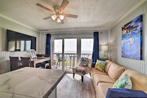a living room with a couch and a ceiling fan at Oceanfront Corpus Christi Escape with Community Pool in Corpus Christi