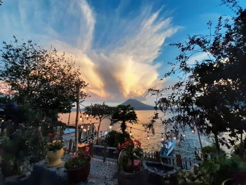 a view of a body of water at sunset at Hotel & Restaurante Arca de Noé in Santa Cruz La Laguna