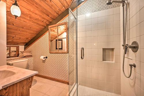 a bathroom with a shower with a glass door at Beautiful Jay Peak Home Near Creek and Waterfalls! in Jay