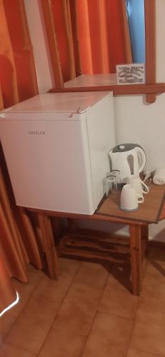 a sewing machine sitting on a wooden table at Villa Mare in Myrtos