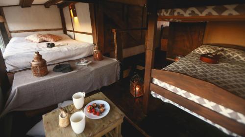 an overhead view of a bedroom with two beds and a table at Ventanas al Mar in Cabo Polonio