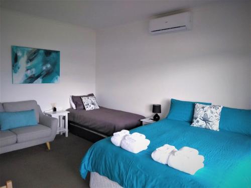 מיטה או מיטות בחדר ב-Banksia Park Estate