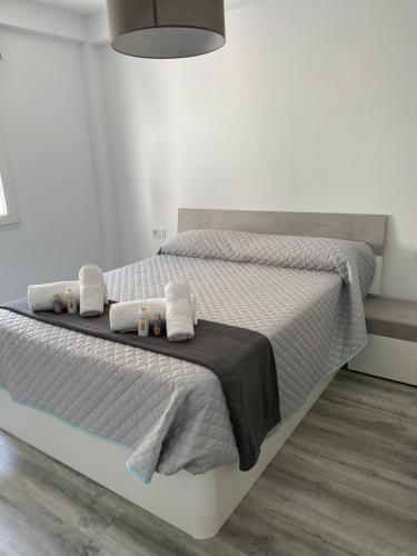 A bed or beds in a room at Apartamento BellaThalía