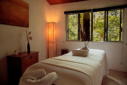 a bedroom with a bed with a box on it at Argovia Ecolodge in Tapachula