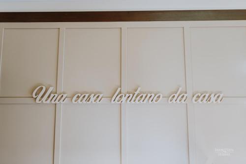 a closet with white doors with the words who can cape leukemia ash care at Il Vecchio Mulino in Brecciarola