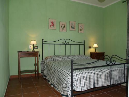 Ένα ή περισσότερα κρεβάτια σε δωμάτιο στο Agriturismo Poggio Sassineri