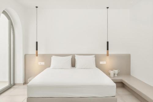 Ένα ή περισσότερα κρεβάτια σε δωμάτιο στο Oyster Luxury Suites