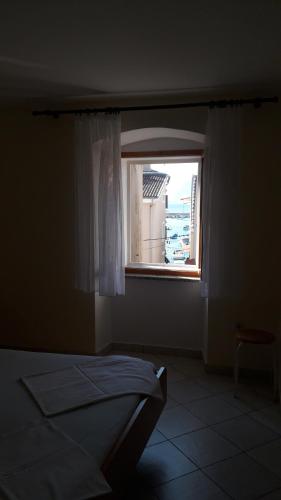 Postel nebo postele na pokoji v ubytování Apartman Dinka