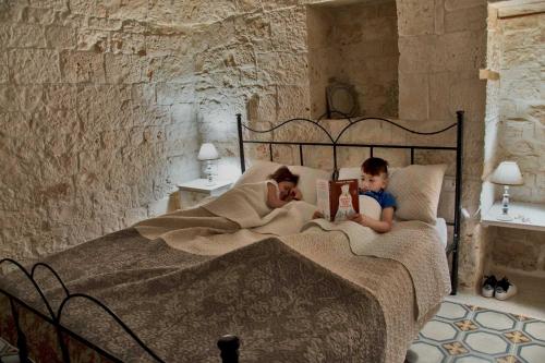 A bed or beds in a room at Trullo Sweet Trullo