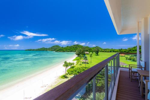 
a view from the balcony of a house overlooking the ocean at Ishigaki Seaside Hotel in Ishigaki Island
