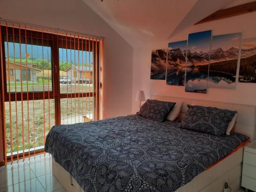 A bed or beds in a room at Mountain Villa near Bansko