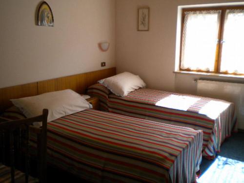 מיטה או מיטות בחדר ב-House Casa Defrancesco