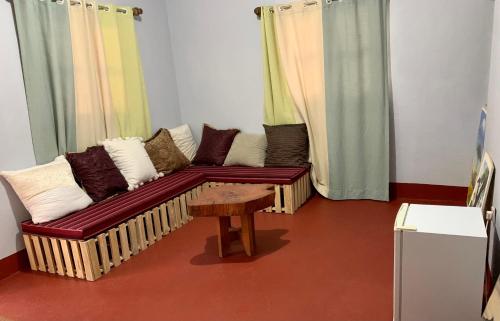 a living room with a couch and a table at Pazuri Hostel in Moshi