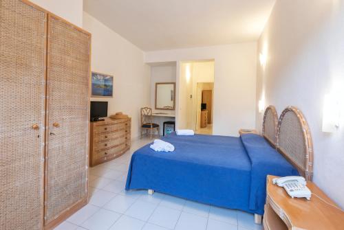 Ένα ή περισσότερα κρεβάτια σε δωμάτιο στο Hotel Oasi Castiglione