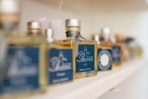 a bottle of alcohol sitting on a shelf at La Petite Aiguebonne in Allex