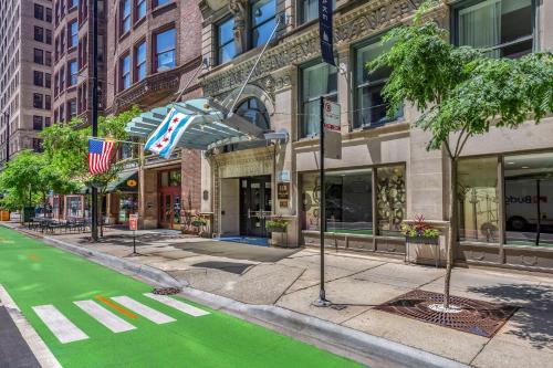 a street with a green crosswalk in front of buildings at Hotel Blake, an Ascend Hotel Collection Member in Chicago