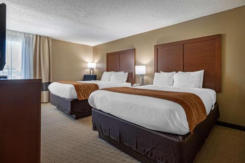 Voodi või voodid majutusasutuse Comfort Inn N Myrtle Beach Barefoot Landing toas