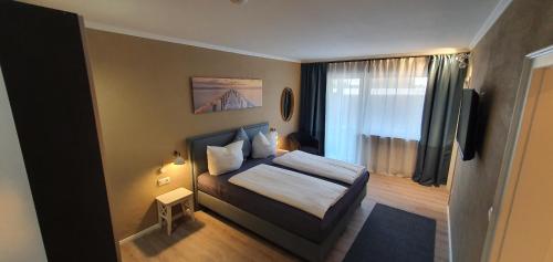 Un pat sau paturi într-o cameră la Strandhaus an der Mosel