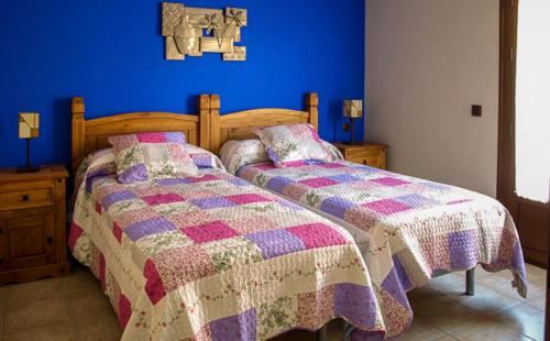 Katil atau katil-katil dalam bilik di Apartamentos Rurales El Calama