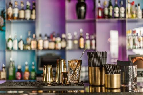 a bar with a bunch of different types of drinks at Best Western Plus Hotel Plaza in Västerås