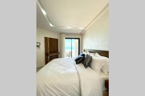Cama o camas de una habitación en Superbe appartement en front de mer haut standing
