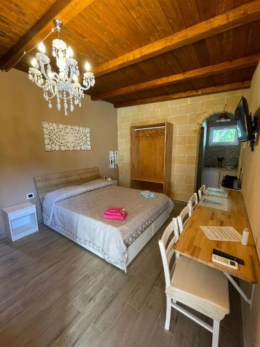 Postel nebo postele na pokoji v ubytování B&B Le Carrube