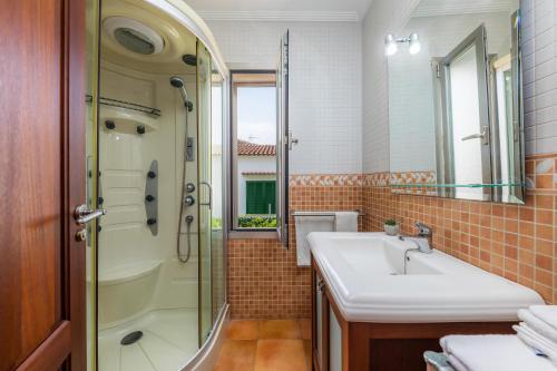 a bathroom with a sink and a shower at Finca Coll in Alcudia