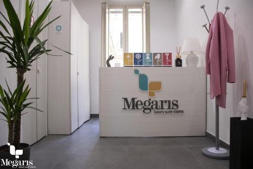 a dressing room with a mexicans sign on the wall at Megaris Luxury Suite Rooms in Naples