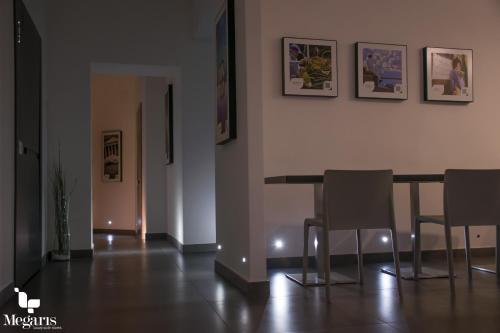 a dining room with a table and chairs at Megaris Luxury Suite Rooms in Naples