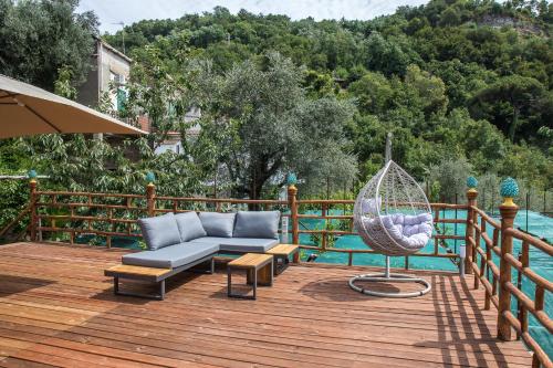 a patio with a hammock and a swing on a deck at Casa Aprea in Sorrento