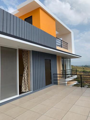 a view of a house with a balcony at ROYAL MEADOWS - IGATPURI Bungalow C in Igatpuri