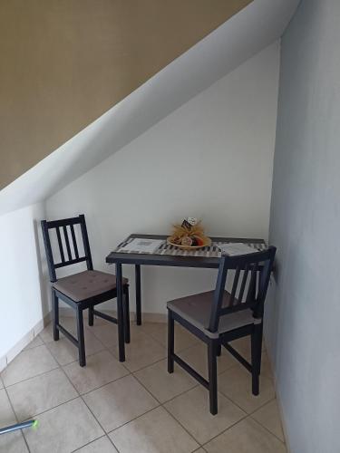 a table and two chairs in a room at Il Faggio 17 B&B in Artena