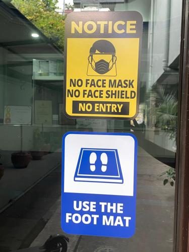 a sign on a door that says no face mask no face shield no entry at Your Choice Hotel in Catbalogan