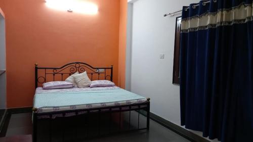 
A bed or beds in a room at Nandini Paying Guest House
