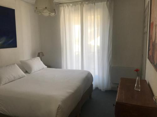 Кровать или кровати в номере Appartement en coeur de ville 2 à 4 personnes