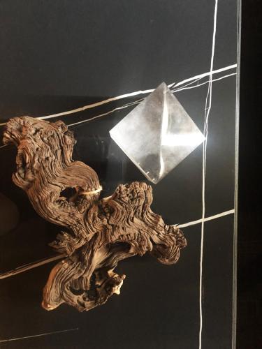 a table with a piece of wood and a piece of paper at binariouno in Bologna