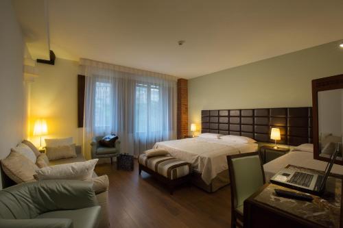 Postel nebo postele na pokoji v ubytování Hotel Alma Domus