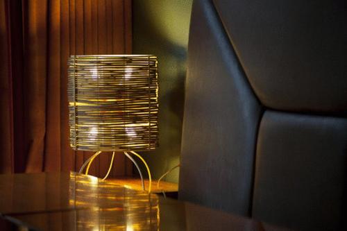 a small lamp sitting on a table next to a couch at Hotel Igartza in Beasain