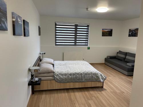 מיטה או מיטות בחדר ב-Helgrindur Guesthouse