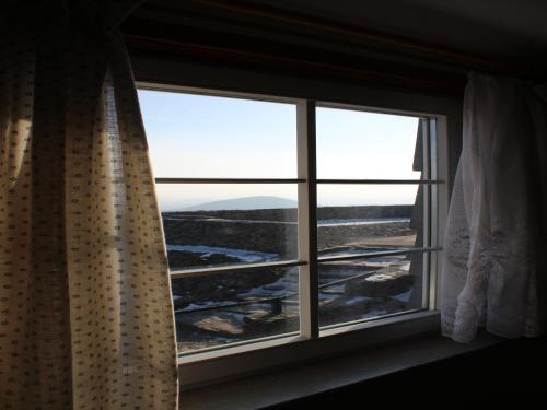 a window with a view of a mountain at Hochwaldbaude in Hain