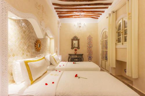 מיטה או מיטות בחדר ב-Riad Palais Des Princesses & Spa