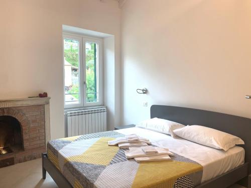 a bedroom with a bed with towels on it at Affittacamere Stella di Mare in Levanto