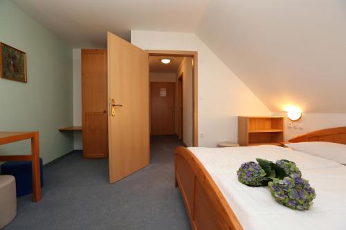 Ένα ή περισσότερα κρεβάτια σε δωμάτιο στο Bed & Breakfast Hisa Resje