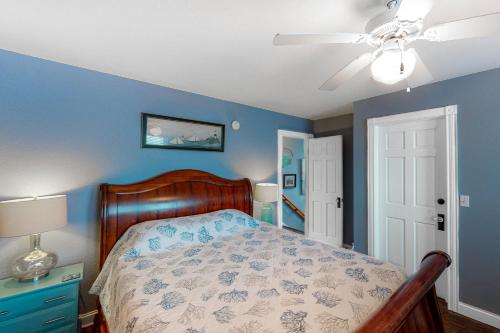 a bedroom with a bed and a ceiling fan at Reel Living #3-AV in Avon